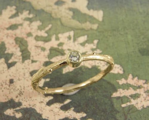 Yellow golden engagement ring 'Orchard' . A twig ring with a  0,10 crt diamond. Oogst Amsterdam.