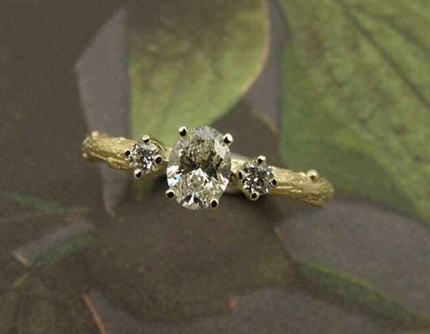 engagement ring 'Orchard'  * yellow gold twig with an oval cut 0,40 ct diamond and 2x brilliant cut 0,05 ct diamonds. Design by Oogst Jewellery in Amsterdam