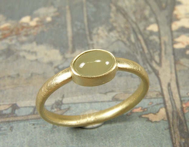 Wedding ring 'Simplicity' in yellow gold with a cabochon cut aquamarine. Design by goldsmith Oogst in Amsterdam.