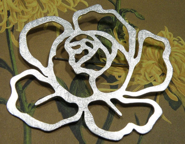 Silver brooch 'In bloom'. Standout pin of a Rose flower. Design by Oogst studio in Amsterdam.