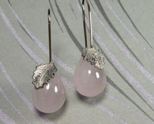 Rose quartz earrings with white gold leaves. Long earrings created by Oogst Jewellery in Amsterdam