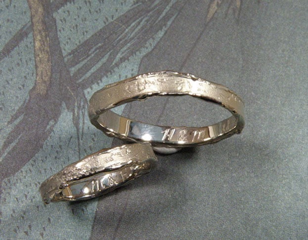 Handmade wedding rings Erosion. Textured golden wedding rings. Design by Oogst goldsmith in Amsterdam