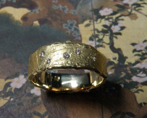 ring 'Erosion' Yellow gold textured ring with diamonds, handmade in the Oogst studio