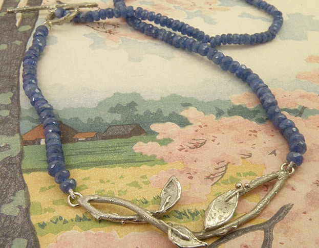 Blog about sapphire. Sapphire necklace with white old twigs and leafs. Oogst studio in Amsterdam.