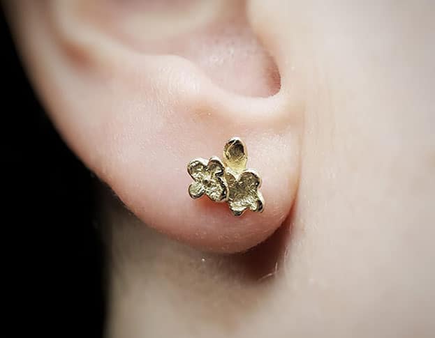 gold Flowers ear studs. Design by Oogst goldsmith in Amsterdam. Independent jewellery designer.