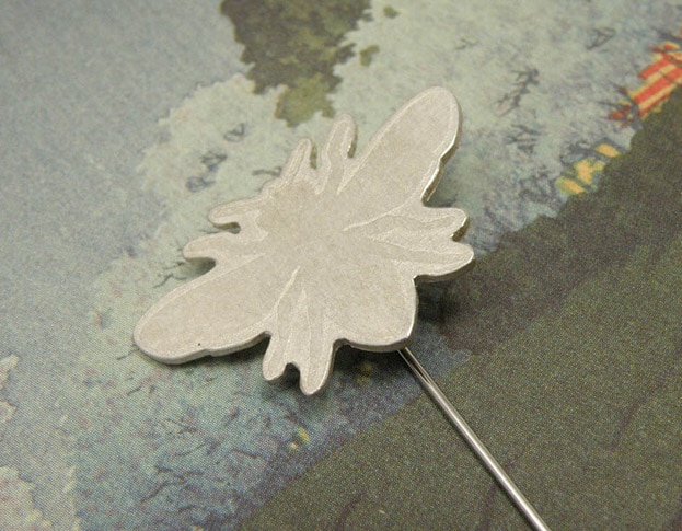 Silver bee pin. Handmade by goldsmith Oogst in Amsterdam.