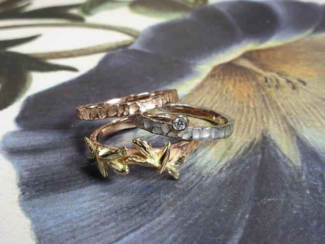 Stack rings Swell and Insects. Rose gold textured ring. White gold ring with diamond. Rose gold ring with yellow gold dragonflies. Goldsmith Amsterdam
