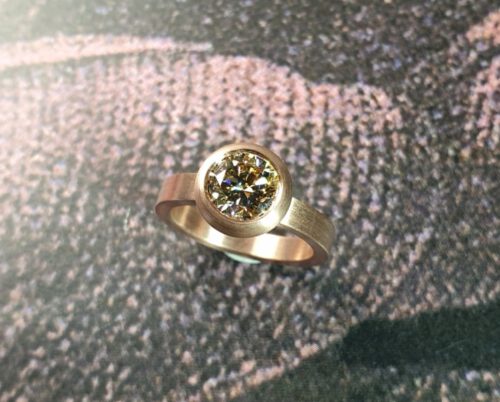 engagement ring 'Boletus' .  Rose gold ring with a 1,5 ct brilliant cut diamond natural light amber in a full bodied setting. Design by Oogst Jewellery