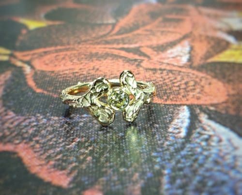engagement ring 'Leaves' with cute heart shaped leaves and a 0,25 ct brilliant cut diamond in cape colour. Handcrafted in the Oogst goldsmith studio