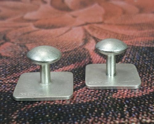 Zilveren manchetknopen met lins mechaniek. Ontwerp van goudsmid Oogst in Amsterdam