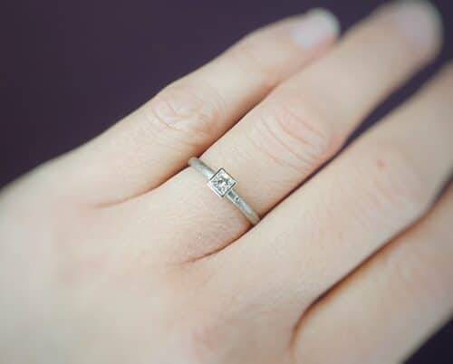 White gold engagement ring with princess cut diamond. Carré. Design by Oogst goldsmith in Amsterdam.
