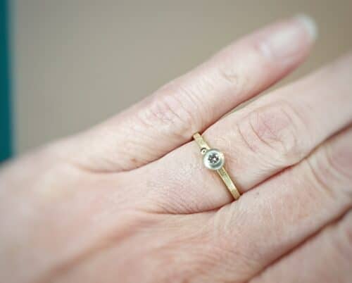 Yellow gold 'Boletus' engagement ring with a diamond and a berry. Oogst goldsmith in Amsterdam