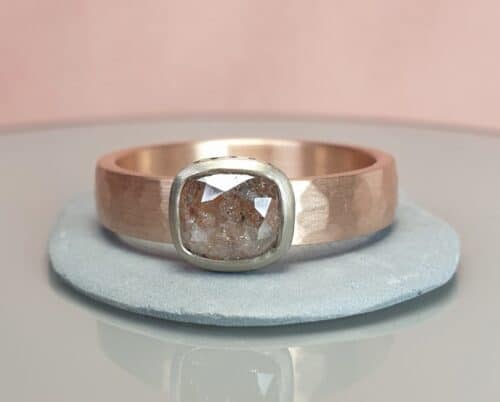 Rose gold Rhythm ring with a natural diamond set in white gold. Design by Oogst jewellery in Amsterdam
