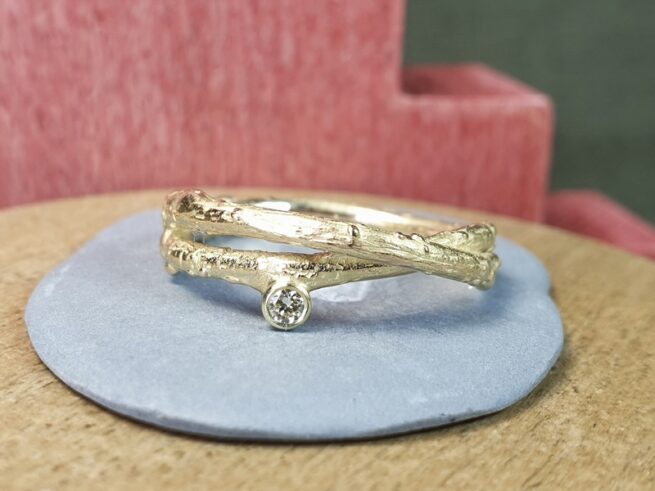Yellow golden 'Orchard' ring with a 0,06 ct diamond. Delicate twig ring. Design by Oogst Jewellery in Amsterdam.