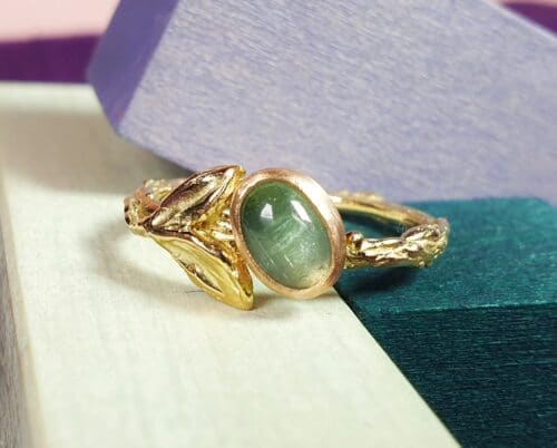 Golden ring with tourmaline and cute leaves  from the ‘Orchard’ series. Design by Oogst Jewelry in Amsterdam