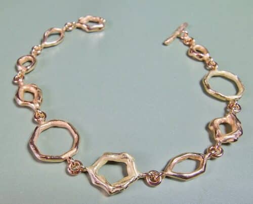 Rosé gold bracelet from the Amorphous & Angular series with 2 yellow gold links. Design by Oogst Jewellery in Amsterdam