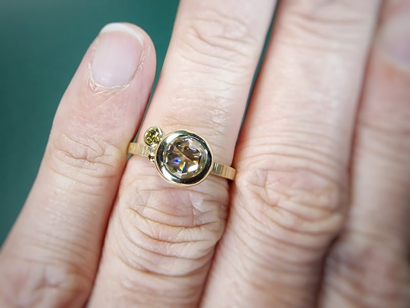 Yellow gold Cluster ring with a 1,01 ct rose cut diamond, a cute berry and a 0,10 ct olive diamond. Show on the finger. Design by Oogst Jewellery in Amsterdam