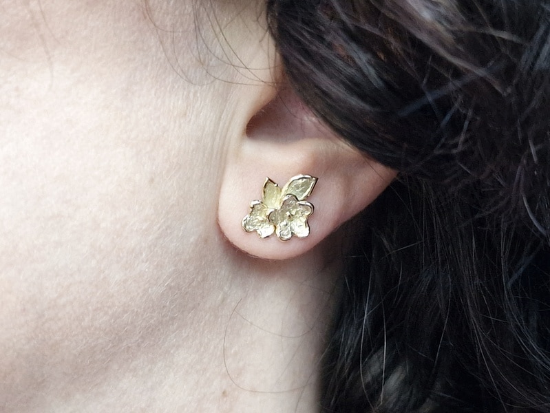 Yellow gold statement flower ear studs from our 'In bloom' series. Standout design by Oogst Jewellery On the ear.