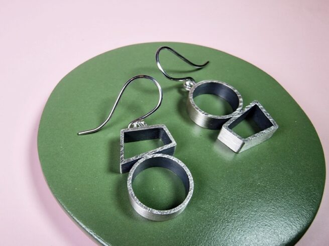 Silver earrings Japonais with a steel hook. Modern sleek design by Oogst Jewellery in Amsterdam