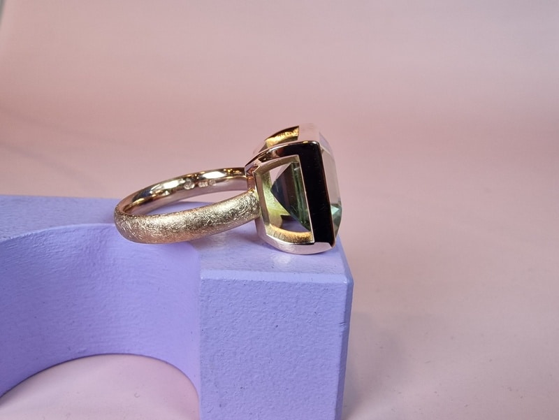 Gemstone ring with prasiolite from our Square series. Statement ring created in the Oogst goldsmith studio in Amsterdam. Seen from the side.