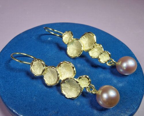 Yellow gold Fungus earrings with fresh water pearls. Standout design by Oogst Jewellery in Amsterdam
