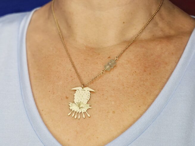 Yellow gold necklace with pendant 'Thistle', worn, designed by Oogst Goldsmith Amsterdam