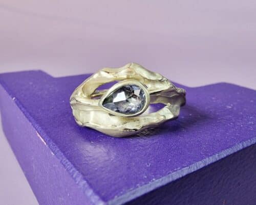 Golden ring Mountain with a salt and pepper diamond, designed by Oogst goldsmith Amsterdam.