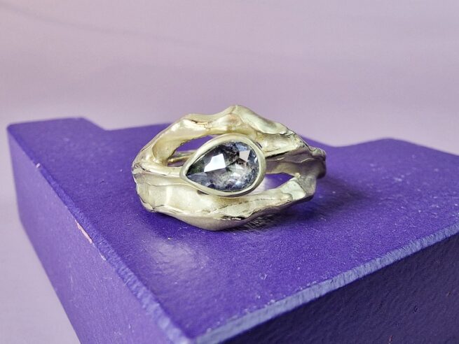 Golden ring Mountain with a salt and pepper diamond, designed by Oogst goldsmith Amsterdam.