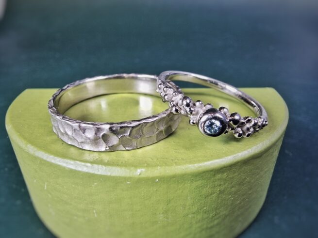 White gold wedding rings with playful texture from the Berries and Swell series. Handmade by Oogst Jewellery in Amsterdam