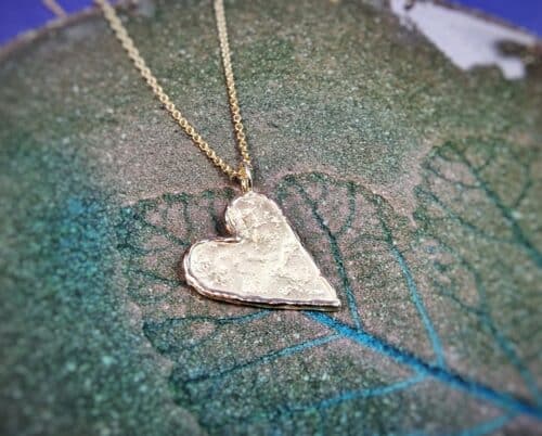 Yellow gold Heart pendant, hand made in the Oogst goldsmith studio in Amsterdam.