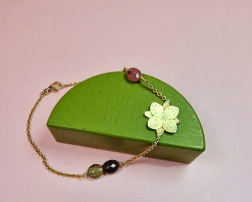 Yellow gold 'In bloom' bracelet with a playful flower and several warm colours tourmaline as accent. Refined bracelet by Oogst Jewellery design in Amsterdam