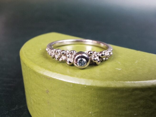 White gold engagement ring Berries with an ice blue diamond. Oogst goldsmith Amsterdam