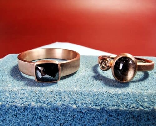 Wedding rings 'Cluster' and 'Simplicity' combined as a beautiful pair. Sleek rose gold designs with tourmaline and diamonds from the Oogst collection.