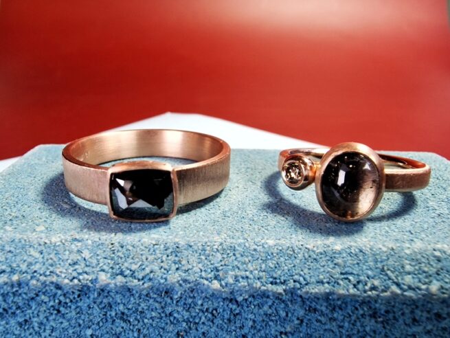 Wedding rings 'Cluster' and 'Simplicity' combined as a beautiful pair.  Sleek rose gold designs with tourmaline and diamonds from the Oogst collection.