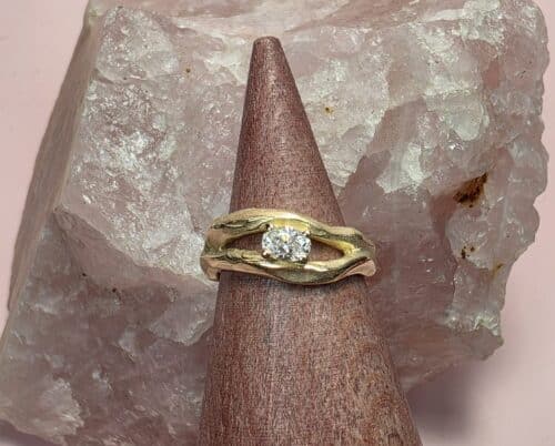 Yellow gold diamond ring Wave with an oval cut diamond. Custom created in the Oogst studio.