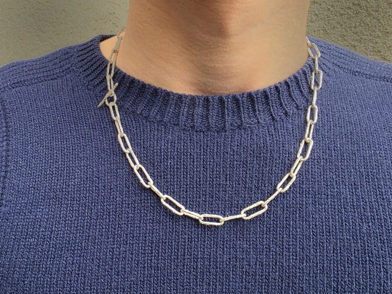Silver necklace with sturdy twig links from our Orchard series. Bold masculine design by Oogst Jewellery in Amsterdam. Seen on model.